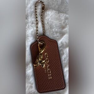 Coach tag with Charm
